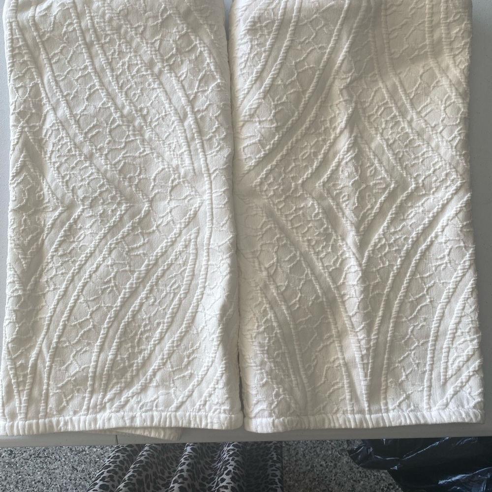 Two king size white metelasse shams